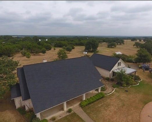 Austin roof installation over a limestone home.