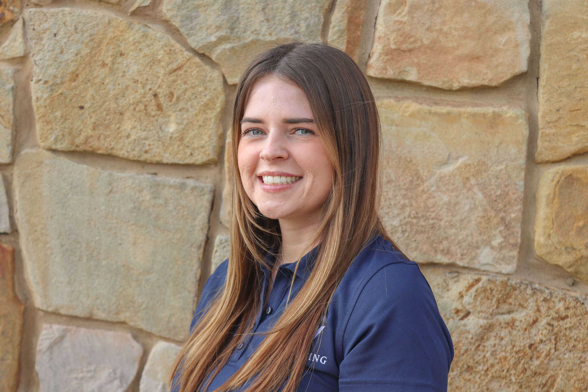Headshot of Hannah Salas, Office Administrator of A&W Roofing Austin.