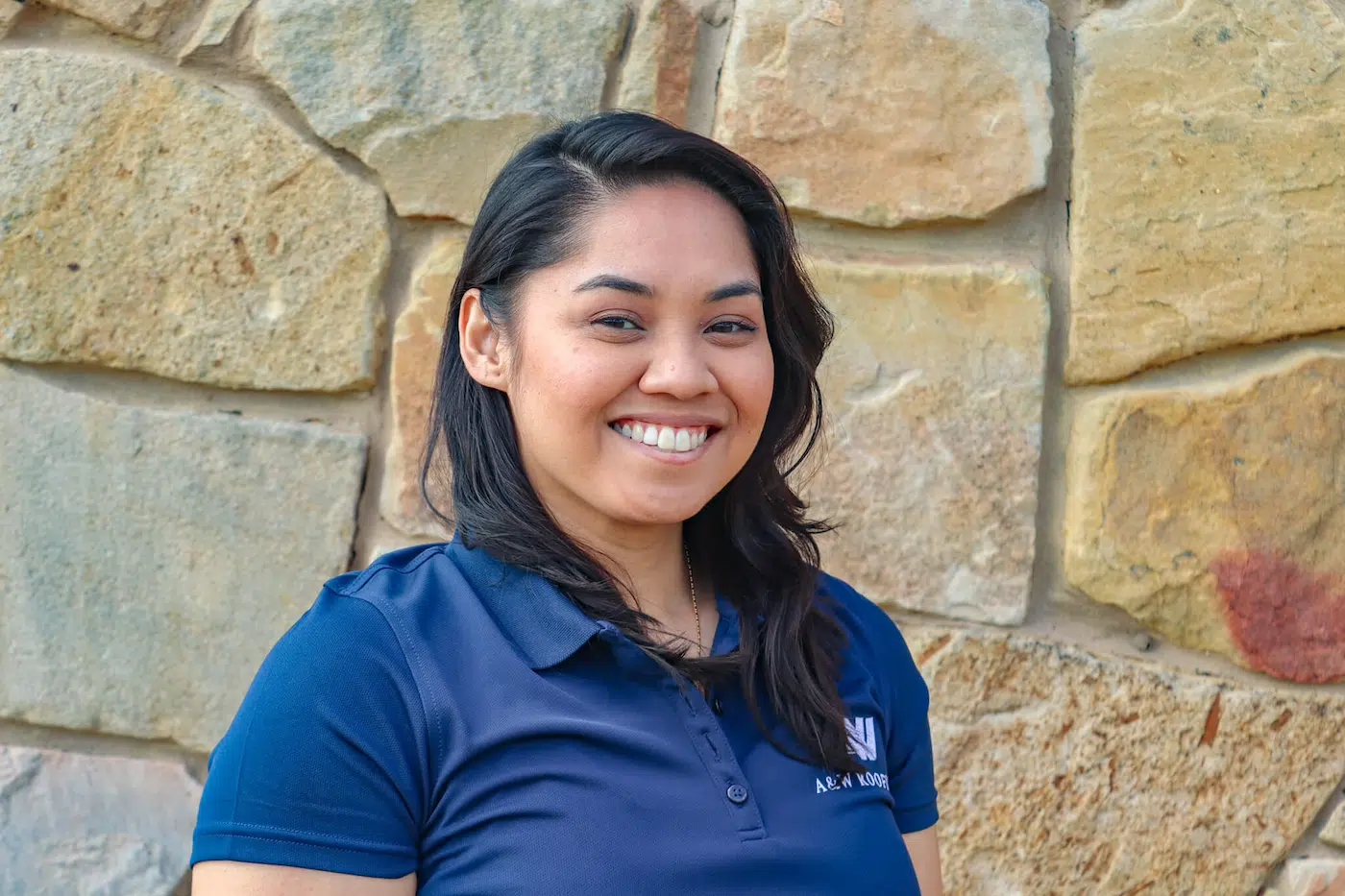 Headshot of Kiara Quitugua, the Roofing Consultant at A&W Roofing Austin.