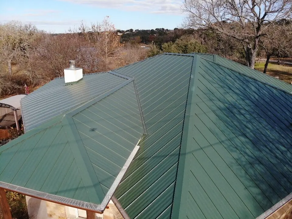 Green metal roof on top of home in Burnet, Texas.