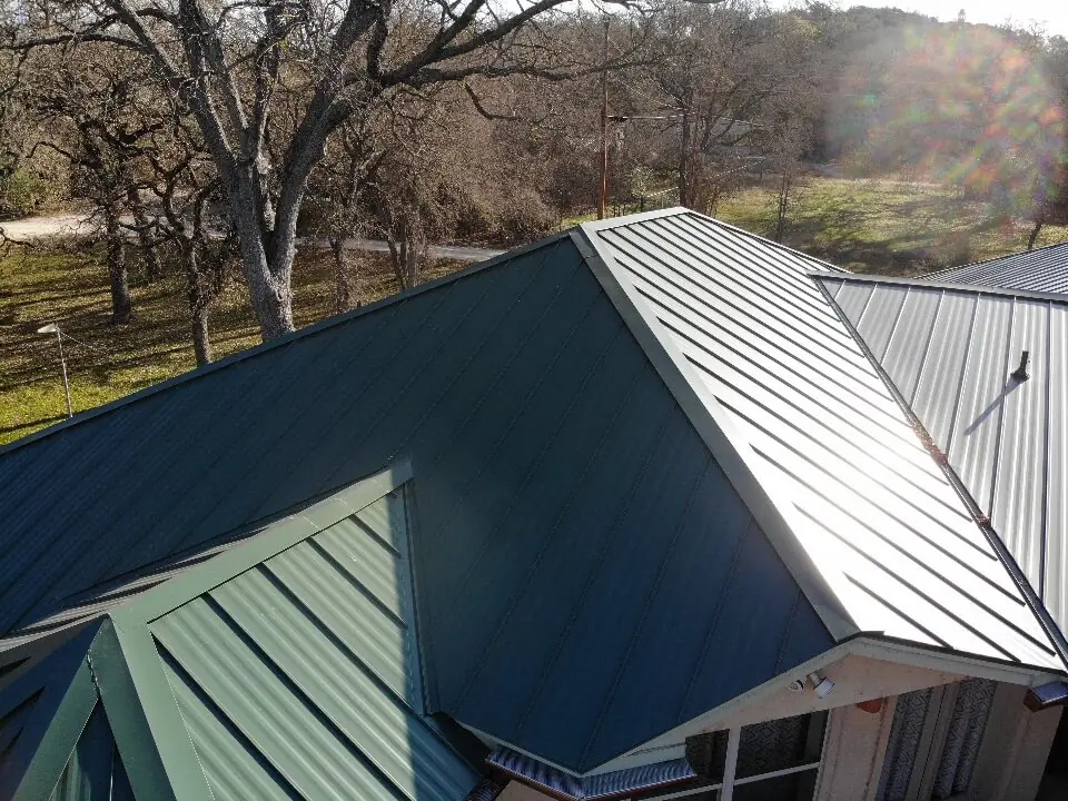 Green metal roof on a home in Burnet, Texas.