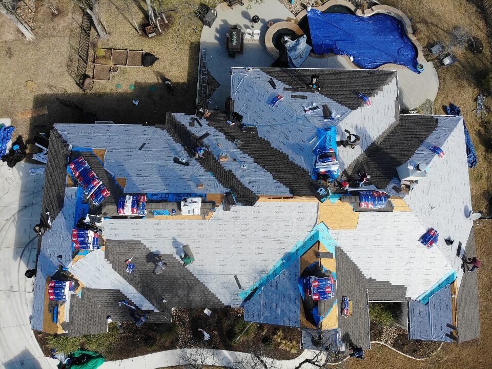 Several A&W roofing contractors working to install a new roof in Liberty Hill.
