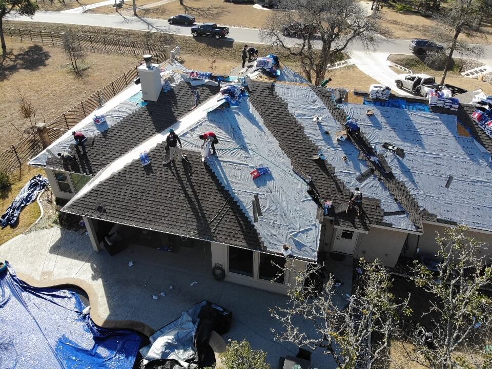 A&W Roofing contractors in the process of installing a new shingle roof for a home in Liberty Hill.