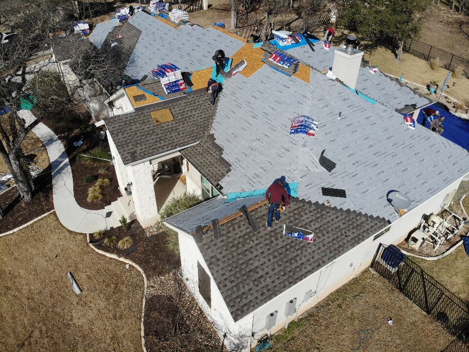A&W roofing contractors in the middle of a roof replacement in Liberty Hill.