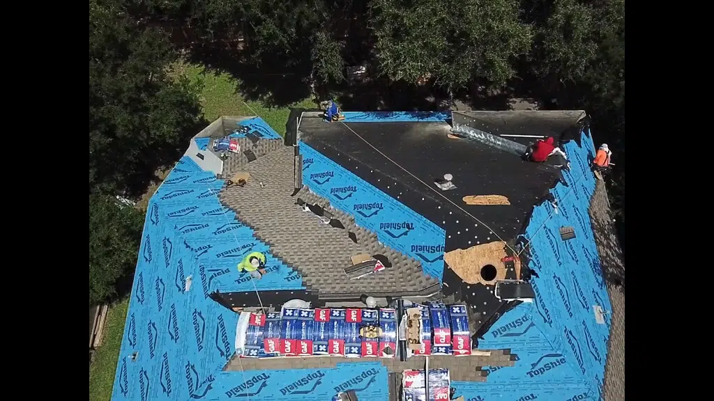 Texas roofing contractors installing a new roof on Pflugerville home.