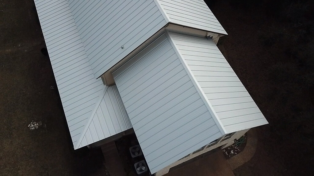 White metal roof on Liberty Hill home with several levels.