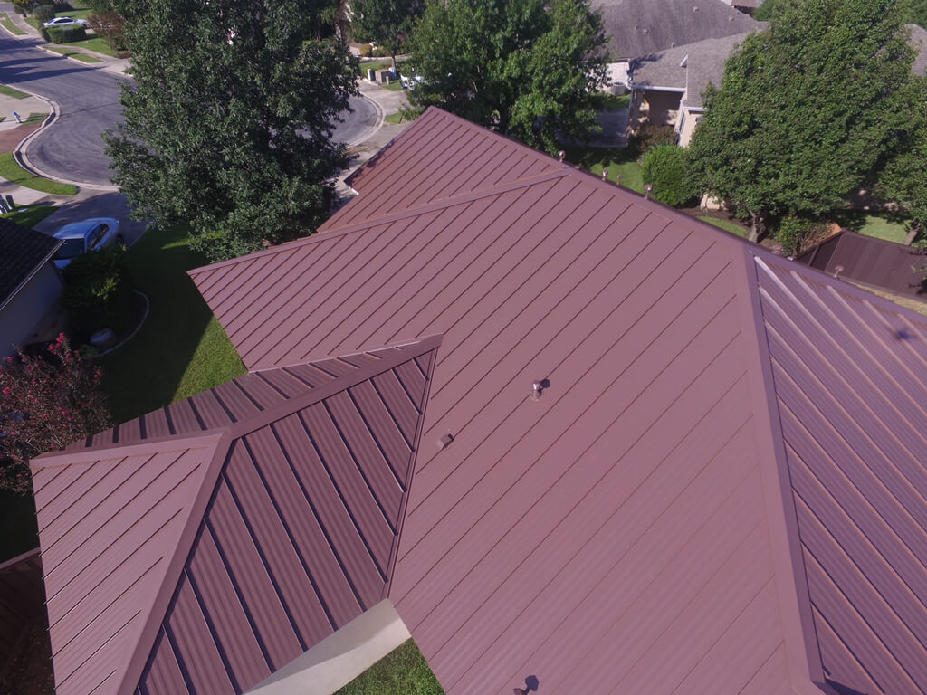 Red metal roof in the cul-de-sac of a neighborhood in Georgetown.