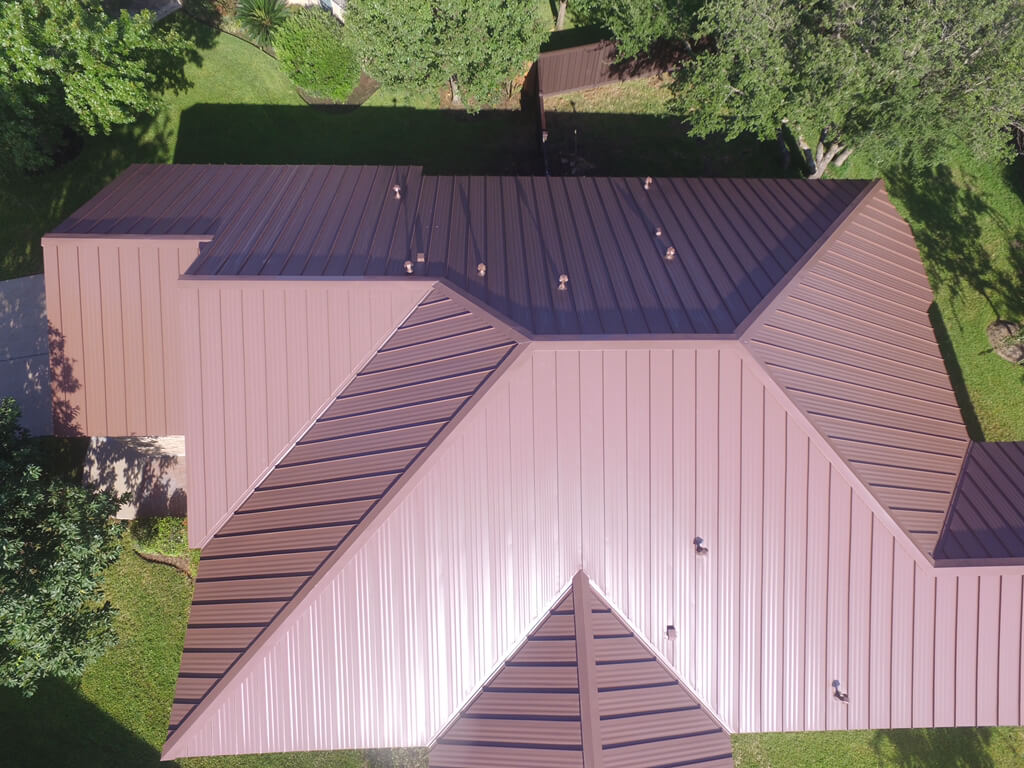 Birds eye view of red metal roof in Georgetown, Texas.