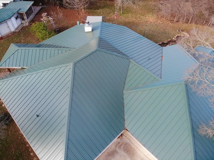 Green metal roof on a home in Austin.