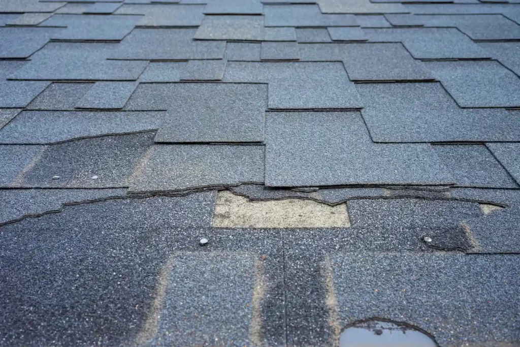 Roof in Austin with chipped and missing shingles
