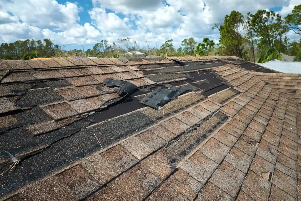 Roof in Austin with several missing shingles.